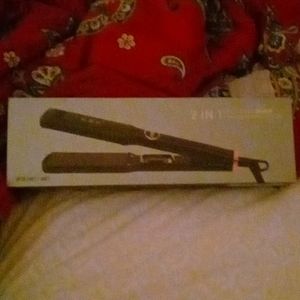 A K&K wet and dry Hair straightener! It's beautiful Rose Pink color Brand New.